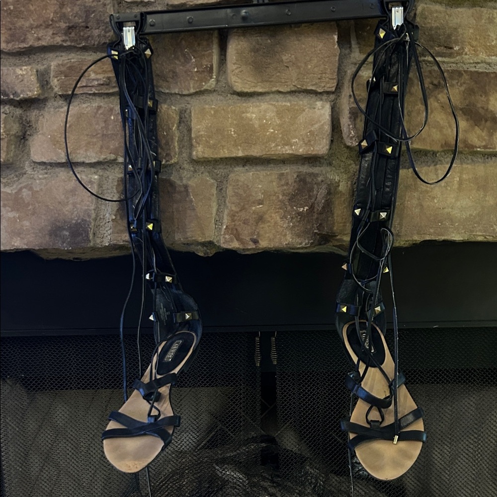 Guess Black Gladiator lace up Sandals in front and zipper in back.